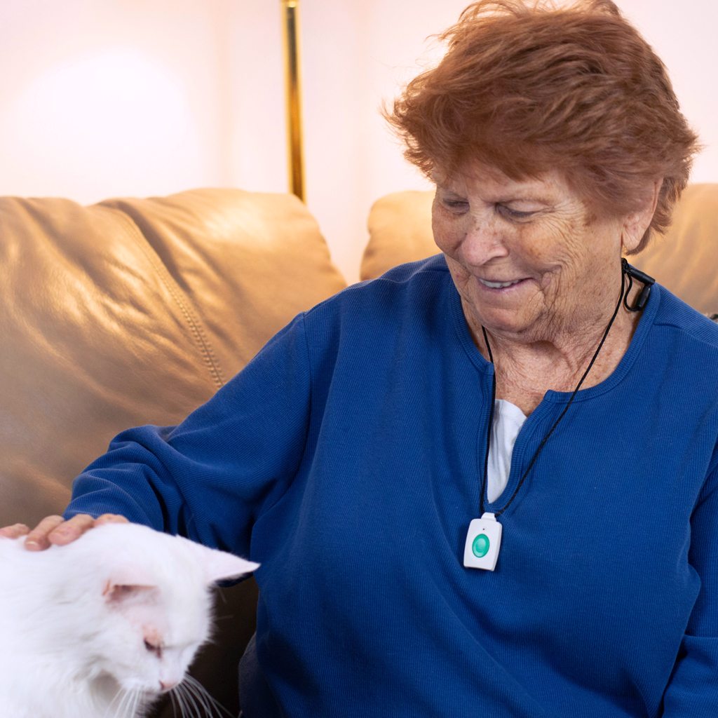 Senior petting white cat